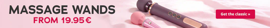 Two massage wands in pink and black are on pink bed. Text: “MASSAGE WANDS from 19.95 €”, red button: “Get the classic”.