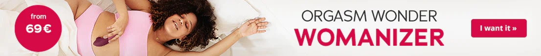 Advertisement banner showing a woman lying on a bed using a purple Womanizer. There is a red circle on the left with the text “from 69 €”. There is also some text on the right that says “Orgasm Wonder Womanizer” and a “I want it” button.
