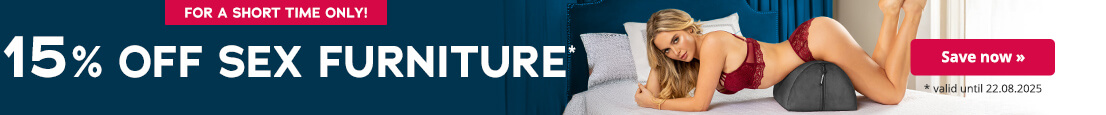 Advertisement with the text: 'For a limited time only! 15% off sex furniture*'. On the right, a red button with the words 'Save now »' and the note '* valid until 22.08.2025'. On the right side of the image, a woman in red lace lingerie lies on her stomach on a grey wedge pillow on a bed, her head slightly raised and looking at the camera.