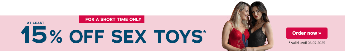 The advertisement has a pink background. The text “At least 15% off sex toys” is written in large teal-coloured letters. The text “* valid until 06.07.2025” is written below in small grey letters. There is a red banner at the top of the advertisement with the text “For a short time only!” written in white letters. Two women can be seen on the right-hand side of the advertisement. They are wearing lace lingerie and have their arms around each other. One woman is wearing red lingerie. The other woman is wearing black lingerie and is holding a blue sex toy in her hand.