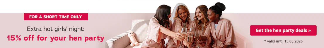 Several women in pink satin dressing gowns are sitting on a beige sofa, laughing and clinking their champagne glasses. The large text says: “Extra hot girls' night: 15% off for your hen party - valid until 15.05.2026.