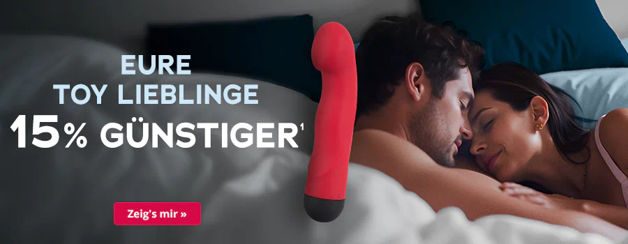 Roter Vibrator auf Bett, Liebespaar im Hintergrund, Text: „Eure Toy Lieblinge 15% günstiger“, Button „Zeig’s mir“.