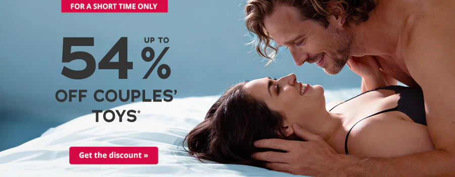 A topless man is lying on top of a woman on a bed. They are both smiling at each other. The woman is wearing black underwear. The background is light blue. The text: “Up to 54 % off couples’ toys” is written in large letters. At the bottom is a red button with white text that says: “Get the discount »”