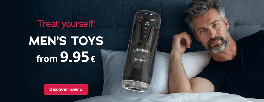 A bearded man in a dark shirt relaxing in bed, with a masturbator shown beside him. Text: "Treat yourself! Men's toys from 9.95 €". CTA: "Discover now".