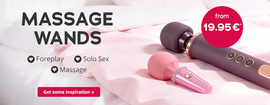 Two massage wands in pink and purple are on a bed. Text: “MASSAGE WANDS”, “Foreplay”, “Solo Sex”, “Massage”, “From 19.95 €”. Red button: “Get some inspiration”.