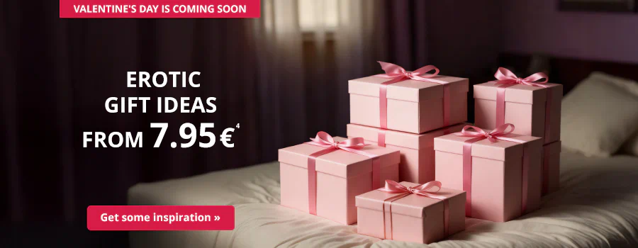 Pink gift boxes with ribbons on a bed, text: “Erotic gift ideas from €7.95”, button “Get inspired”, reference to Valentine’s Day.