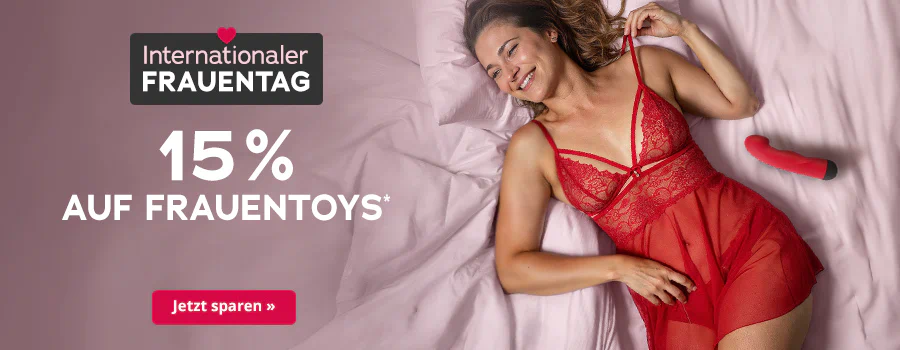 Werbebanner zum Internationalen Frauentag mit Herz-Icon, Text „15 % auf Frauentoys“, Frau in roter Spitzenwäsche und rotes Toy, Button „Jetzt sparen“.