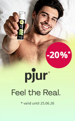 A smiling, topless man is lying down on a white background. He is holding a bottle of pjur gel up to the camera. A red circle says: “-20%”. There is also some text that says: “pjur – Feel the Real.” and “valid until 25.06.2026”.