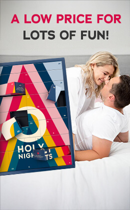 The advertisement has a picture of a man in a white T-shirt lying on a bed. A woman is leaning over him. She is wearing a white blouse. They are smiling at each other. The Advent calendar with a colourful design and the text “HOLY NIGHTS” is prominently displayed. The sentence: “A low price for lots of fun” is written above in red and black letters.