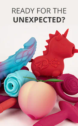 A red, unicorn-shaped sex toy can be seen amongst other colourful toys in pink, blue and purple, as well as a light peach-coloured toy. There is some text at the top in black capital letters that says: “READY FOR THE UNEXPECTED?”. There is some text on a red button at the bottom of the advertisement that says: “Discover extraordinary sex toys”.