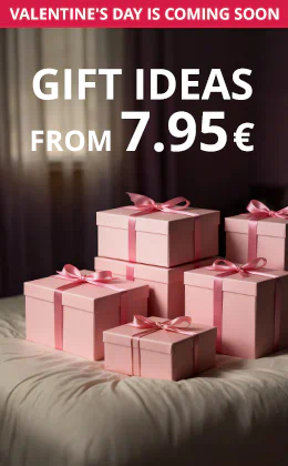 Pink gift boxes with ribbons on a bed, text: “Erotic gift ideas from €7.95”, button “Get inspired”, reference to Valentine’s Day.